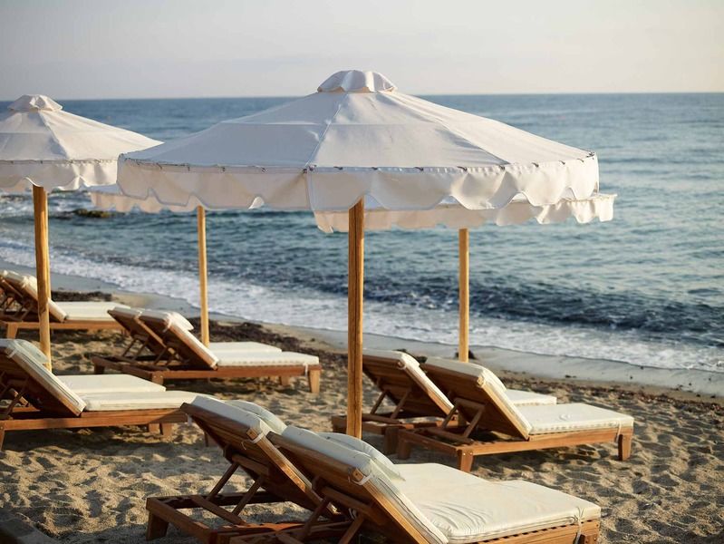 Mitsis Selection Laguna Херсонисос Екстериор снимка Beach chairs and umbrella